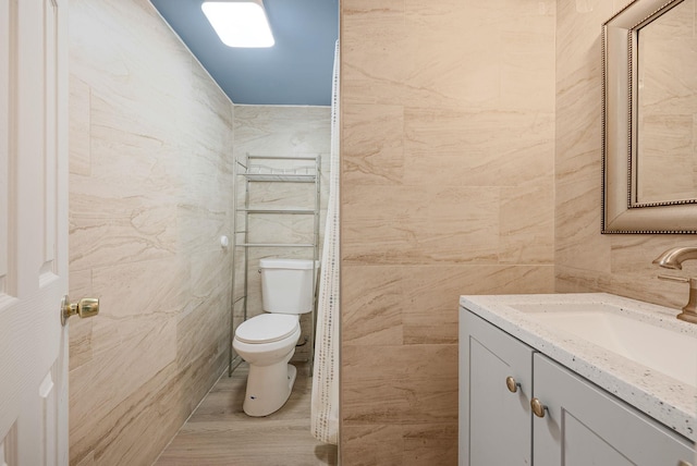 299 Orchid Dr, Mastic Beach, NY 11951 - bathroom featuring tile walls and vanity