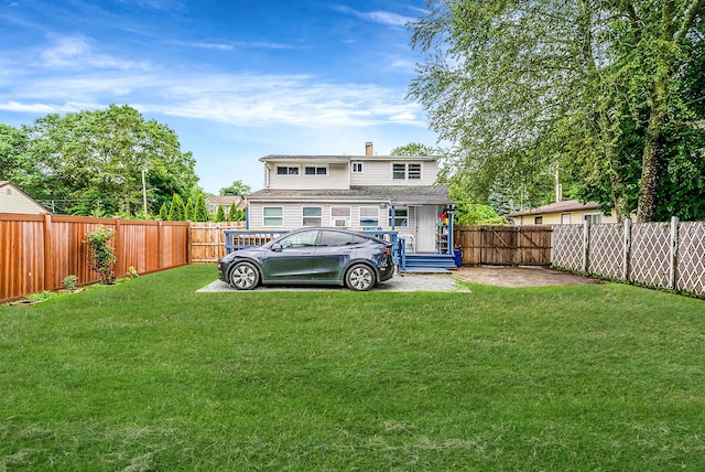 299 Orchid Dr, Mastic Beach, NY 11951 - rear view of house featuring a chimney and a fenced backyard