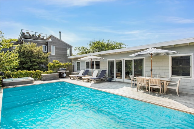 230 Bay Walk, Fire Island Pines, NY 11782 - view of swimming pool with a deck, grilling area, outdoor dining area, and a jacuzzi