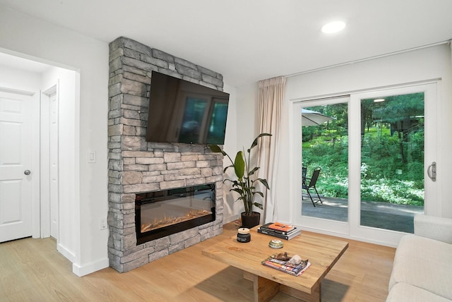 7 Fayer Ct, Phillipsport, NY 12790 - living room featuring light wood-style floors and a fireplace