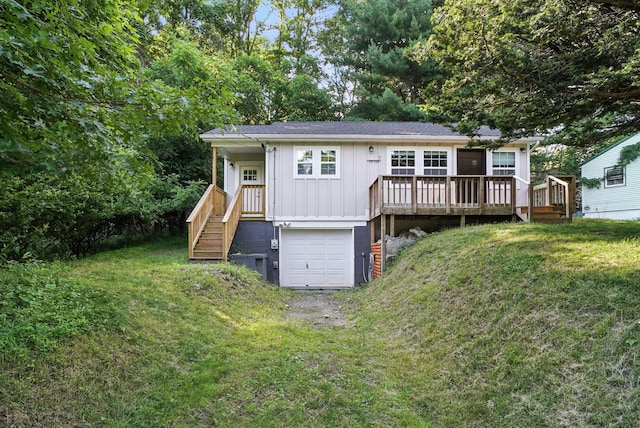 7 Fayer Ct, Phillipsport, NY 12790 - rear view of property featuring board and batten siding, a yard, stairs, and an attached garage