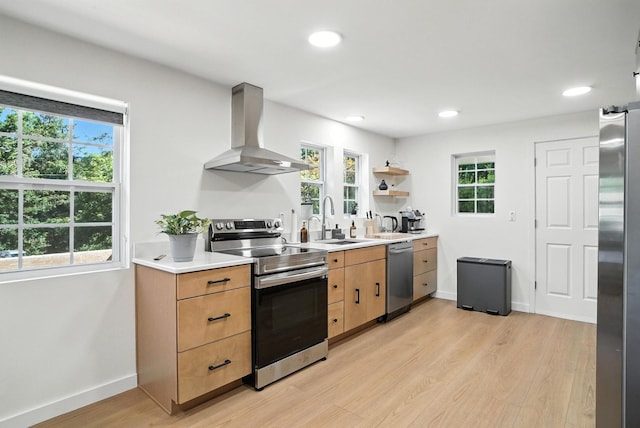 7 Fayer Ct, Phillipsport, NY 12790 - kitchen featuring appliances with stainless steel finishes, extractor fan, light wood-style floors, light countertops, and healthy amount of natural light