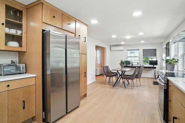 7 Fayer Ct, Phillipsport, NY 12790 - kitchen with stainless steel appliances, a wall mounted air conditioner, light wood-style flooring, light countertops, and recessed lighting