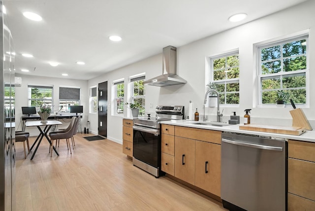 7 Fayer Ct, Phillipsport, NY 12790 - kitchen with appliances with stainless steel finishes, wall chimney range hood, light wood-style flooring, light countertops, and recessed lighting