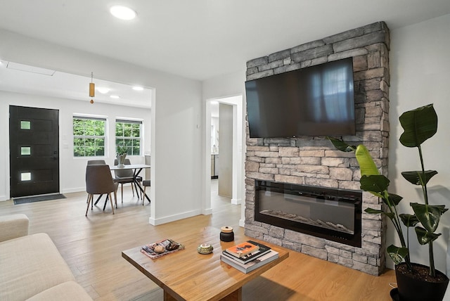7 Fayer Ct, Phillipsport, NY 12790 - living area featuring light wood finished floors and a stone fireplace