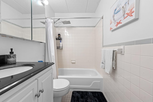 3220 Fairfield Ave Unit 6A, Bronx, NY 10463 - full bath with tile walls, a textured ceiling, vanity, shower / bathtub combination with curtain, and tile patterned flooring
