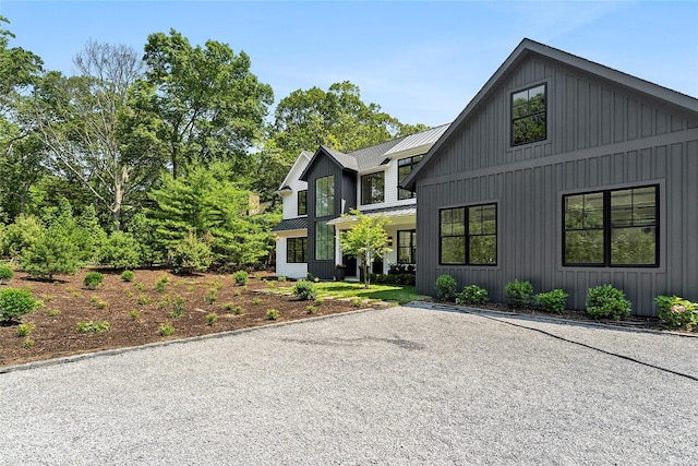 7 Rosemary Ln, Sag Harbor, NY 11963 - modern farmhouse with a metal roof and board and batten siding