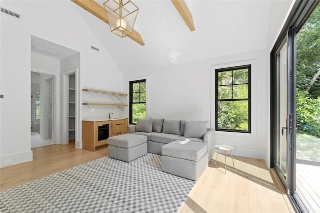 7 Rosemary Ln, Sag Harbor, NY 11963 - living room with light wood-style floors, high vaulted ceiling, and plenty of natural light