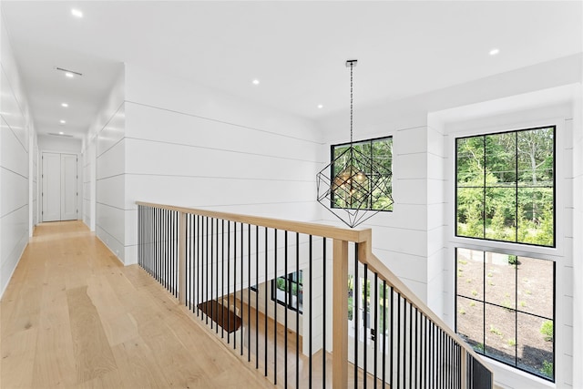 7 Rosemary Ln, Sag Harbor, NY 11963 - hall featuring wood finished floors, recessed lighting, an upstairs landing, and a chandelier