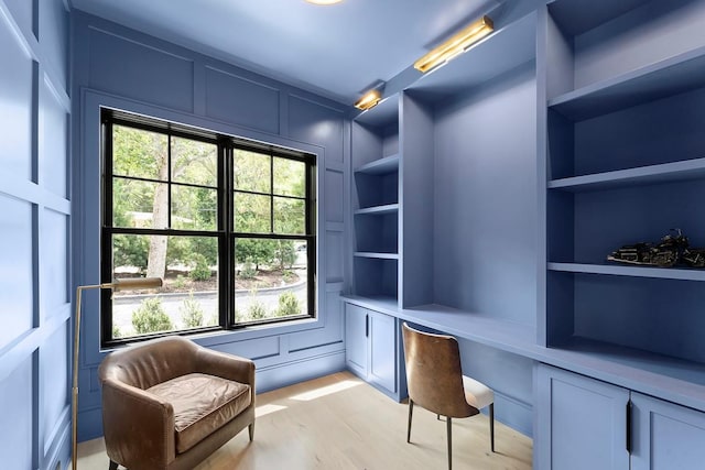 7 Rosemary Ln, Sag Harbor, NY 11963 - office space with built in desk, plenty of natural light, light wood finished floors, built in features, and a decorative wall