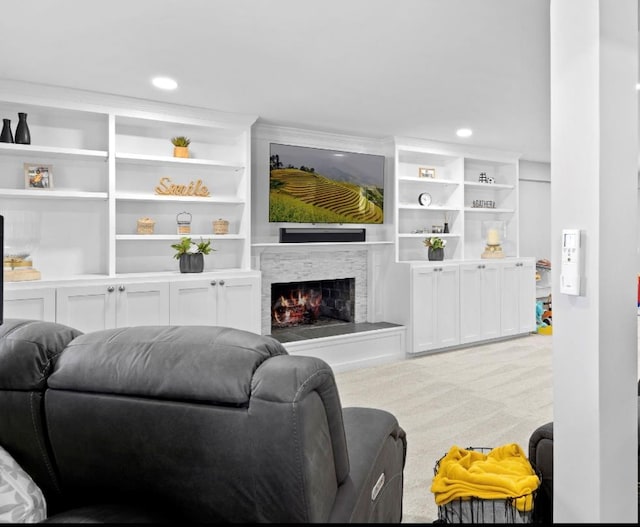 881 Surf St, Lindenhurst, NY 11757 - living room featuring light colored carpet, a warm lit fireplace, recessed lighting, and built in shelves