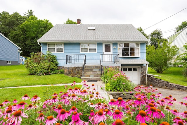 511 Walnut St, Hurley, NY 12443 - view of front of house featuring a chimney, roof with shingles, an attached garage, and a front yard