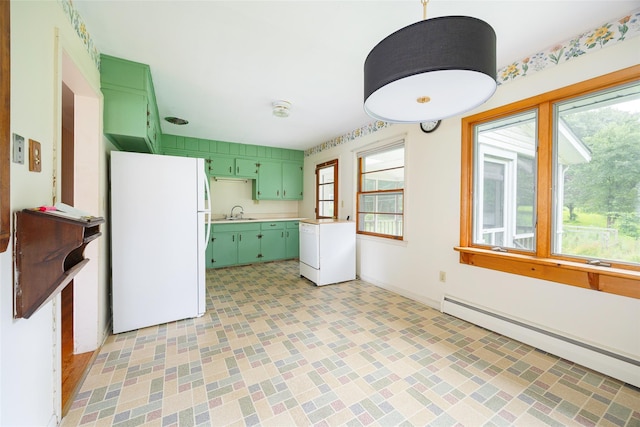 511 Walnut St, Hurley, NY 12443 - kitchen featuring green cabinets, freestanding refrigerator, light countertops, and a baseboard heating unit