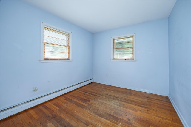 511 Walnut St, Hurley, NY 12443 - empty room featuring a baseboard radiator and wood finished floors