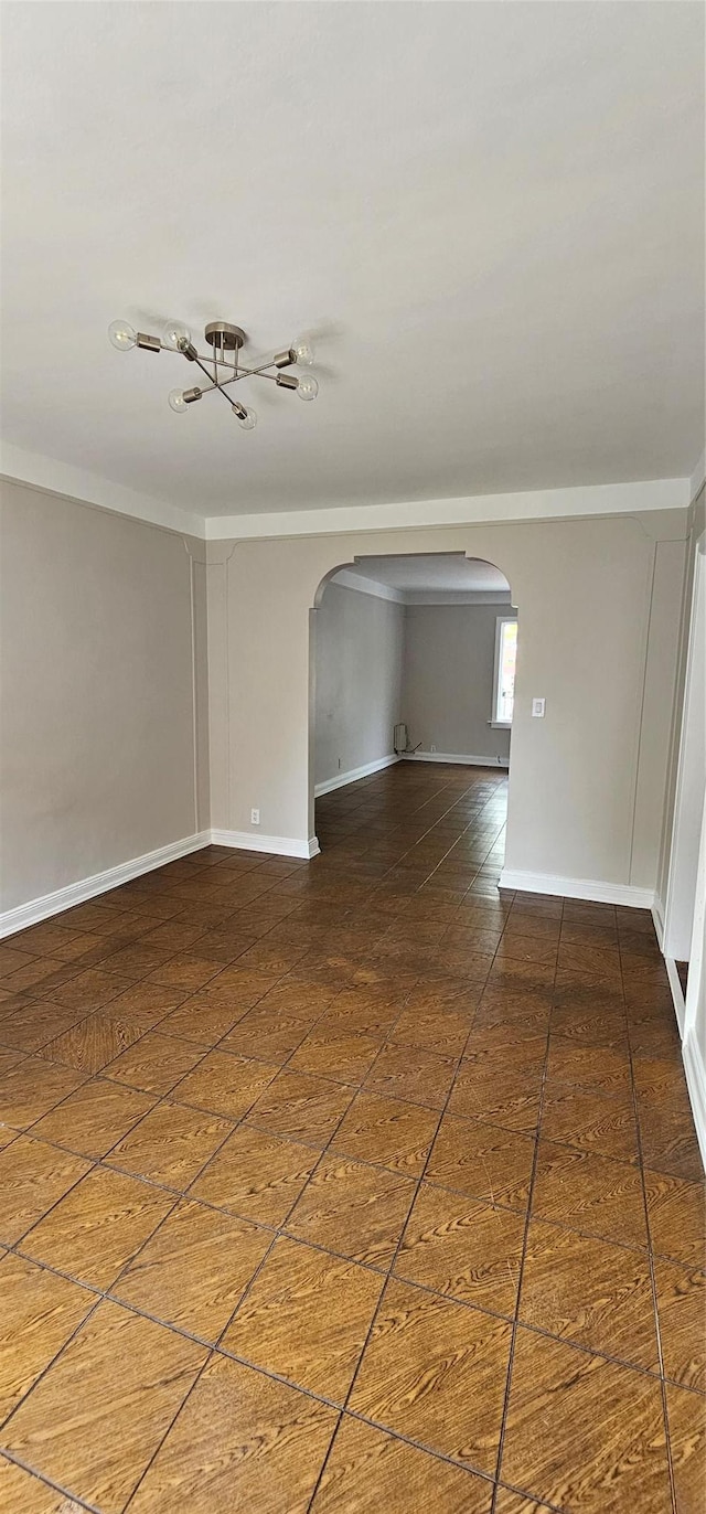 5203 72nd Pl, Maspeth, NY 11378 - empty room with arched walkways and crown molding