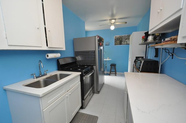 29 Abeel St Unit 4L, Yonkers, NY 10705 - kitchen with stainless steel gas range, ceiling fan, white cabinets, and light countertops