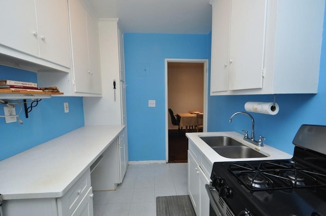 29 Abeel St Unit 4L, Yonkers, NY 10705 - kitchen featuring range with gas stovetop, white cabinets, light countertops, and built in desk