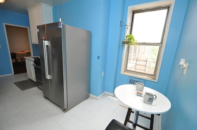 29 Abeel St Unit 4L, Yonkers, NY 10705 - kitchen featuring freestanding refrigerator, light floors, white cabinetry, and stove