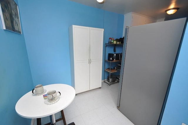 29 Abeel St Unit 4L, Yonkers, NY 10705 - kitchen with freestanding refrigerator, light flooring, and white cabinets