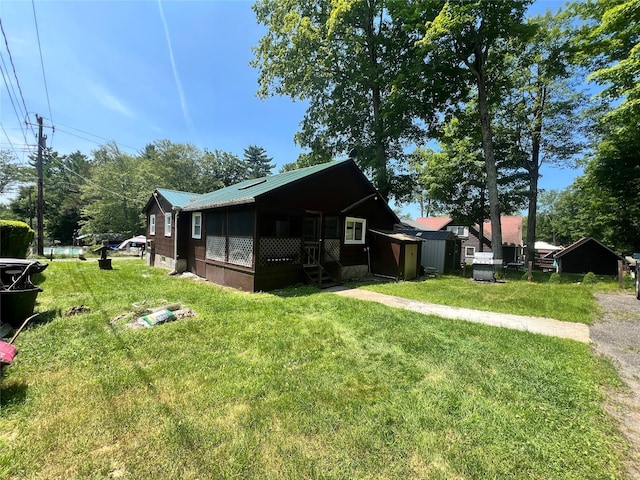 71 Keller Ave, Smallwood, NY 12778 - view of side of property with a lawn, a metal roof, and a shed