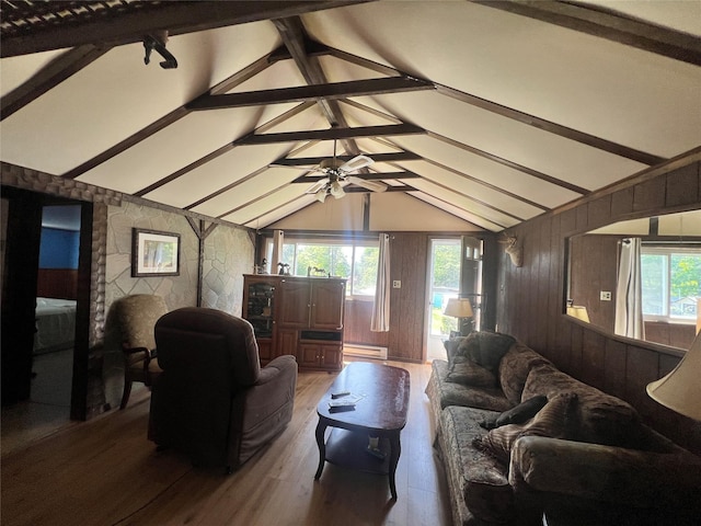 71 Keller Ave, Smallwood, NY 12778 - living area featuring healthy amount of natural light, wood finished floors, a baseboard heating unit, wood walls, and ceiling fan