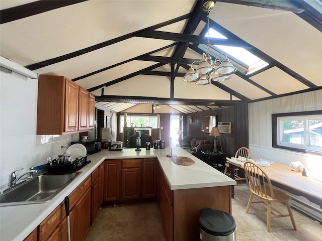 71 Keller Ave, Smallwood, NY 12778 - kitchen featuring a peninsula, light countertops, plenty of natural light, and black microwave