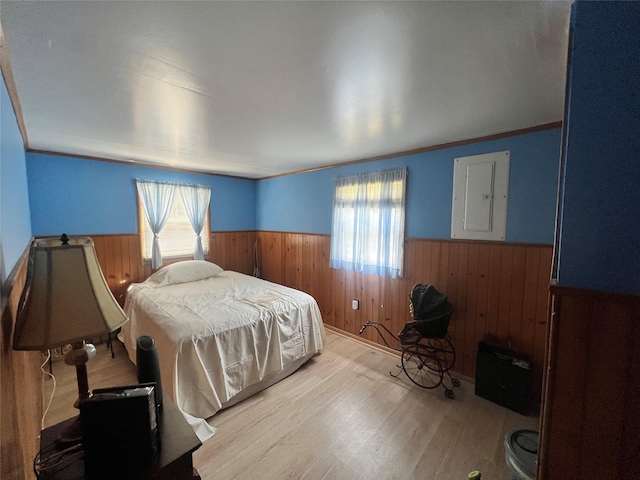 71 Keller Ave, Smallwood, NY 12778 - bedroom with a wainscoted wall, electric panel, wooden walls, wood finished floors, and ornamental molding