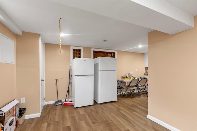 32-17 110, East Elmhurst, NY 11369 - kitchen with freestanding refrigerator, light wood-style floors, and recessed lighting