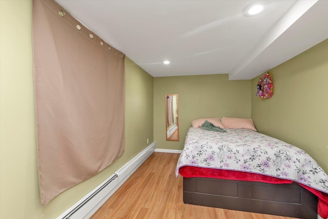 32-17 110, East Elmhurst, NY 11369 - bedroom featuring light wood-style flooring, a baseboard heating unit, and recessed lighting