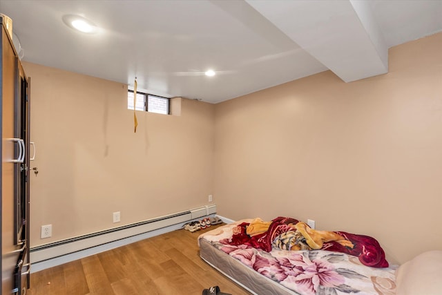 32-17 110, East Elmhurst, NY 11369 - bedroom with a baseboard heating unit, wood finished floors, and recessed lighting