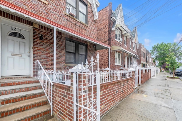32-17 110, East Elmhurst, NY 11369 - property entrance featuring brick siding