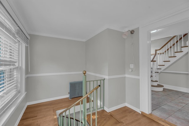 643 Deer Park Ave, Babylon, NY 11702 - stairs with radiator, wood finished floors, and ornamental molding