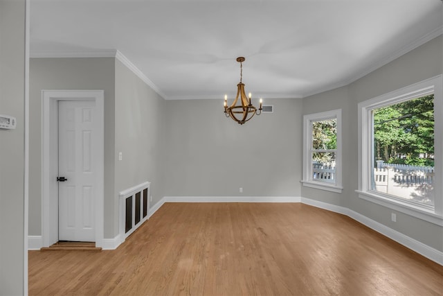 643 Deer Park Ave, Babylon, NY 11702 - unfurnished room featuring light wood-style floors, a chandelier, and ornamental molding