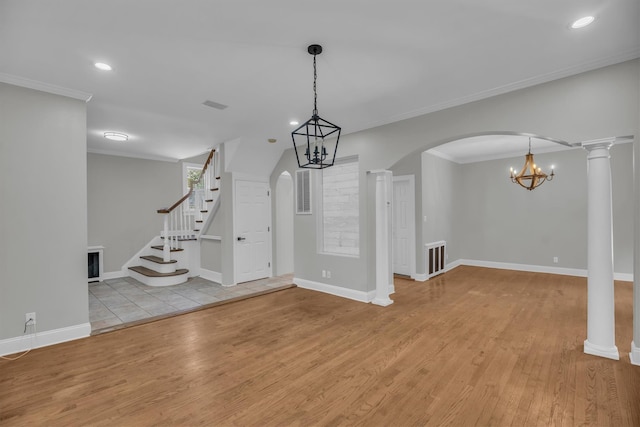 643 Deer Park Ave, Babylon, NY 11702 - spare room featuring wood finished floors, arched walkways, stairs, recessed lighting, and ornamental molding