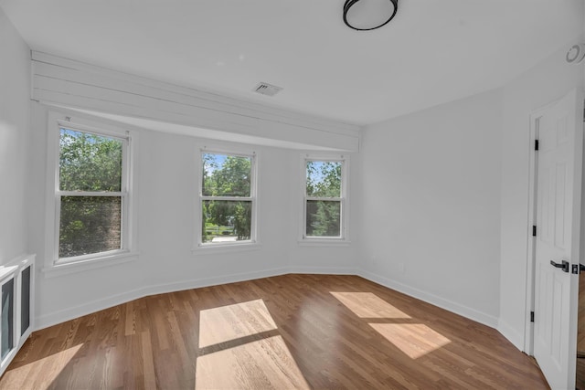 643 Deer Park Ave, Babylon, NY 11702 - unfurnished room featuring healthy amount of natural light and wood finished floors
