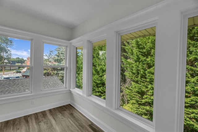 643 Deer Park Ave, Babylon, NY 11702 - unfurnished sunroom featuring wood finished floors and healthy amount of natural light