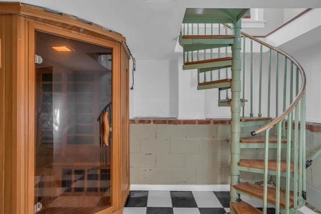 643 Deer Park Ave, Babylon, NY 11702 - staircase with tile patterned floors, a sauna / steam room, and concrete block wall