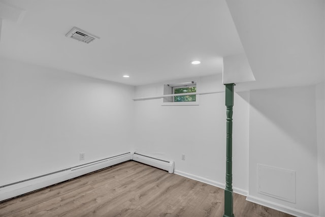 643 Deer Park Ave, Babylon, NY 11702 - basement with wood finished floors, recessed lighting, and baseboard heating