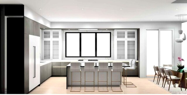 15 Oceanview Dr, Southampton, NY 11968 - kitchen featuring a kitchen breakfast bar, gray cabinets, light wood-type flooring, and glass insert cabinets