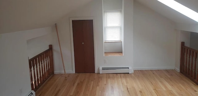 190 Union St, Poughkeepsie, NY 12601 - additional living space with a baseboard heating unit, light wood finished floors, lofted ceiling, a skylight, and baseboard heating