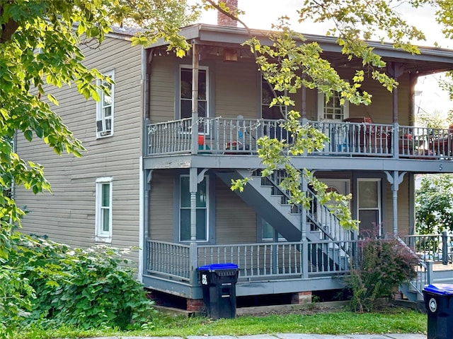 5 Jefferson St, Poughkeepsie, NY 12601 - back of house featuring a chimney and covered porch