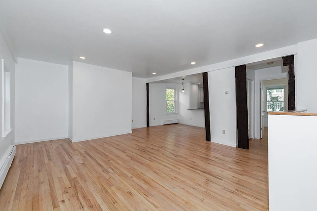 5 Jefferson St, Poughkeepsie, NY 12601 - spare room featuring light wood-style flooring, a baseboard radiator, and recessed lighting