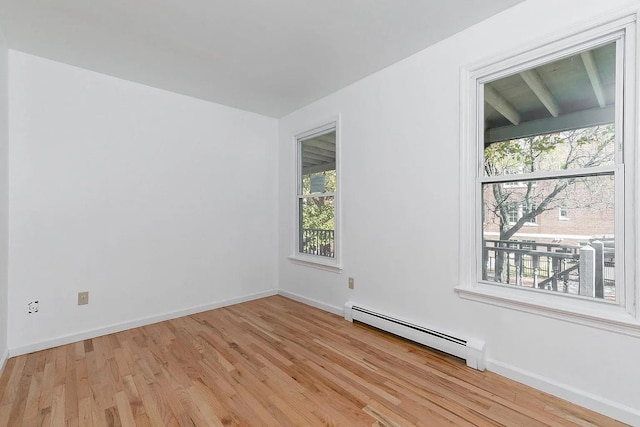 5 Jefferson St, Poughkeepsie, NY 12601 - unfurnished room featuring a baseboard radiator and light wood-type flooring