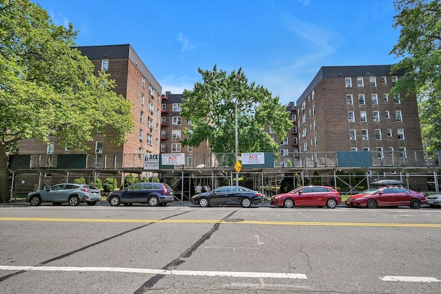 65-05 Yellowstone Blvd Unit 1A, Forest Hills, NY 11375 - view of apartment building / complex featuring view of commercial area