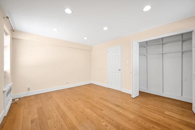 65-05 Yellowstone Blvd Unit 1A, Forest Hills, NY 11375 - unfurnished bedroom featuring light wood-style flooring, recessed lighting, and a closet