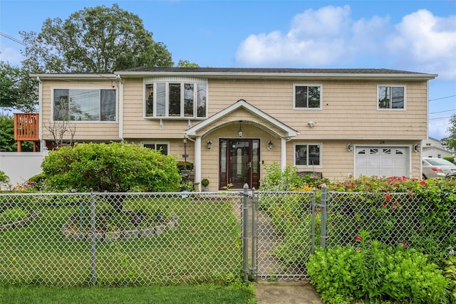 24 Hickory St, Deer Park, NY 11729 - colonial inspired home featuring a fenced front yard, a garage, and a gate