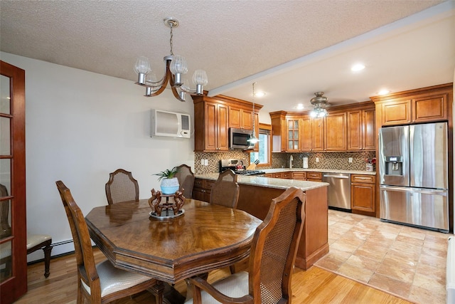 24 Hickory St, Deer Park, NY 11729 - kitchen with appliances with stainless steel finishes, brown cabinetry, backsplash, a baseboard heating unit, and glass insert cabinets