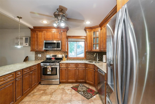 24 Hickory St, Deer Park, NY 11729 - kitchen with stainless steel appliances, brown cabinetry, ceiling fan, and recessed lighting