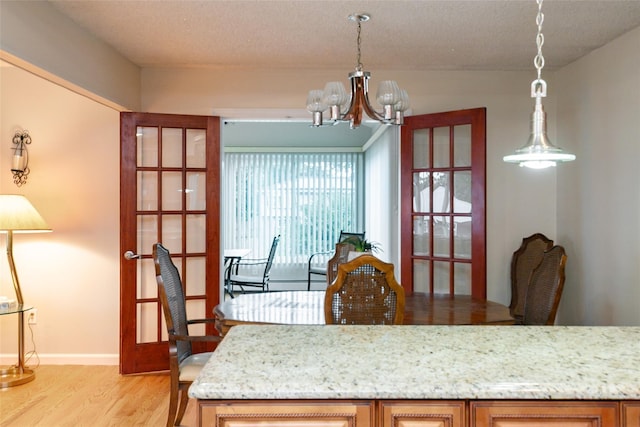 24 Hickory St, Deer Park, NY 11729 - dining room with light wood finished floors and a chandelier