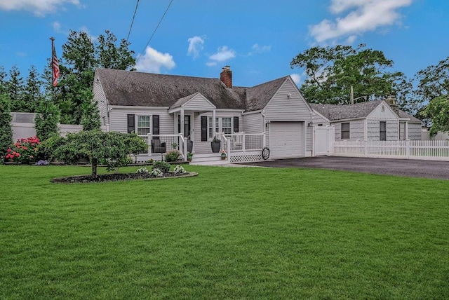66 Eimer St, Patchogue, NY 11772 - cape cod home with an attached garage, driveway, and a chimney